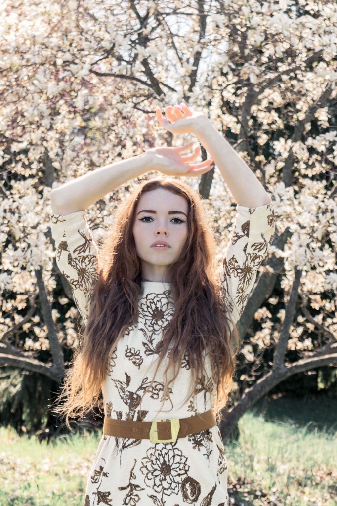 Model Cassie with arms raised among white blossoms — Abigail Dumlao Photography & Film