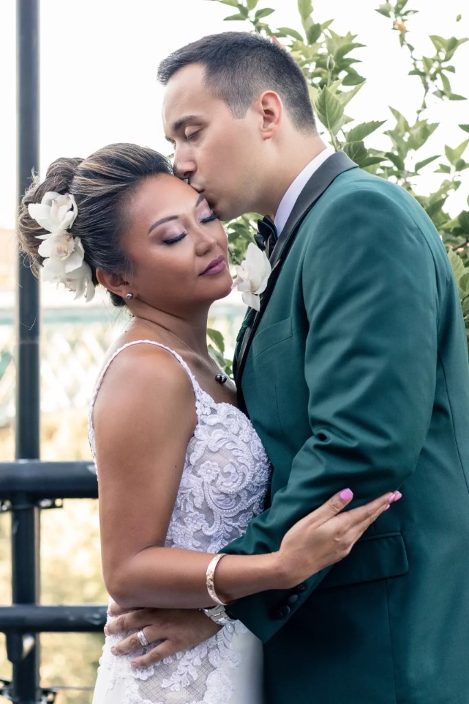 Bride cheering under reception string lights — Abigail Dumlao Photography & Film